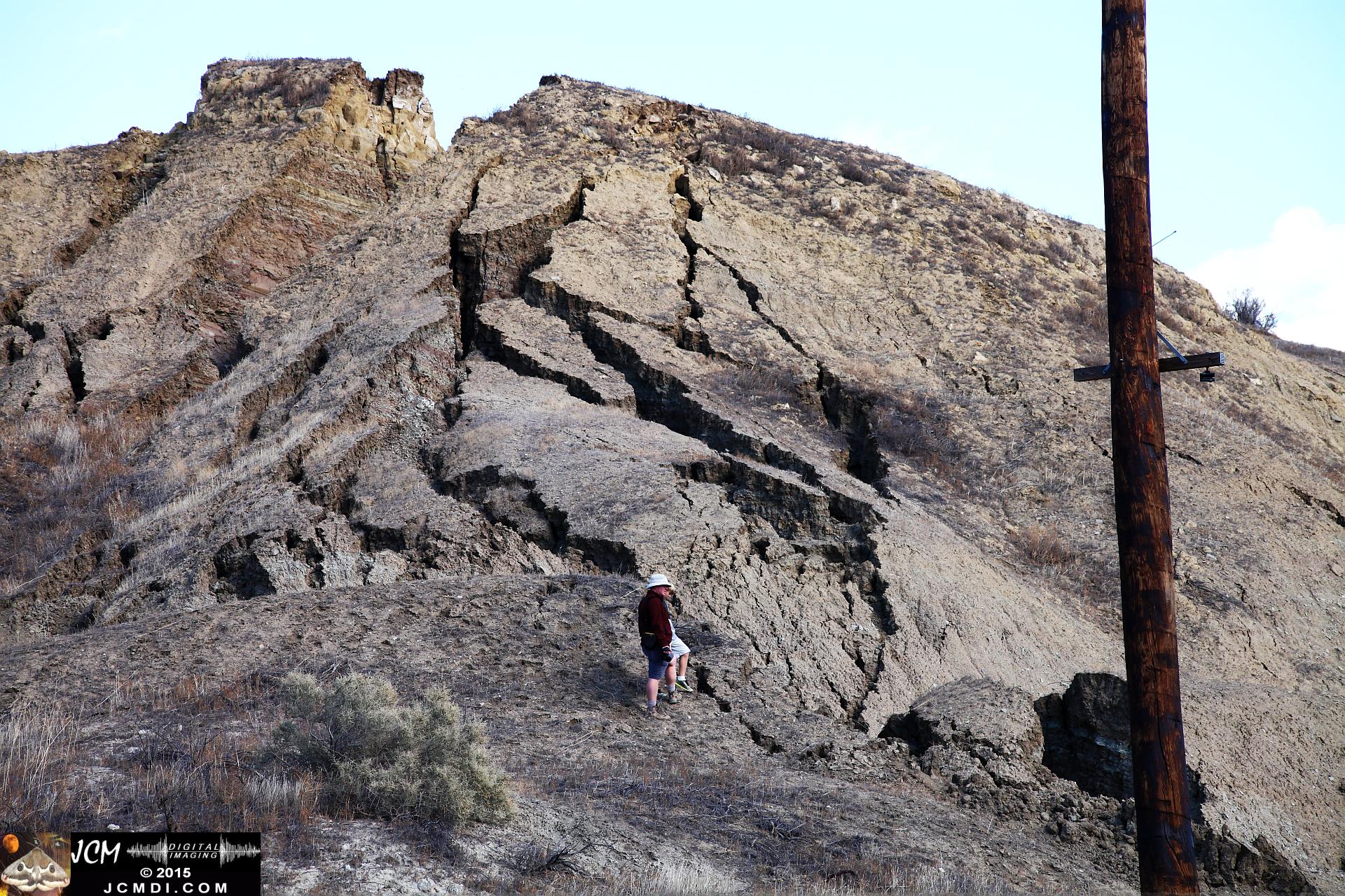 Landslide, buckled pavement, and terrain at Vasquez Canyon Road in Santa Clarita, CA filmed 11-25-2015